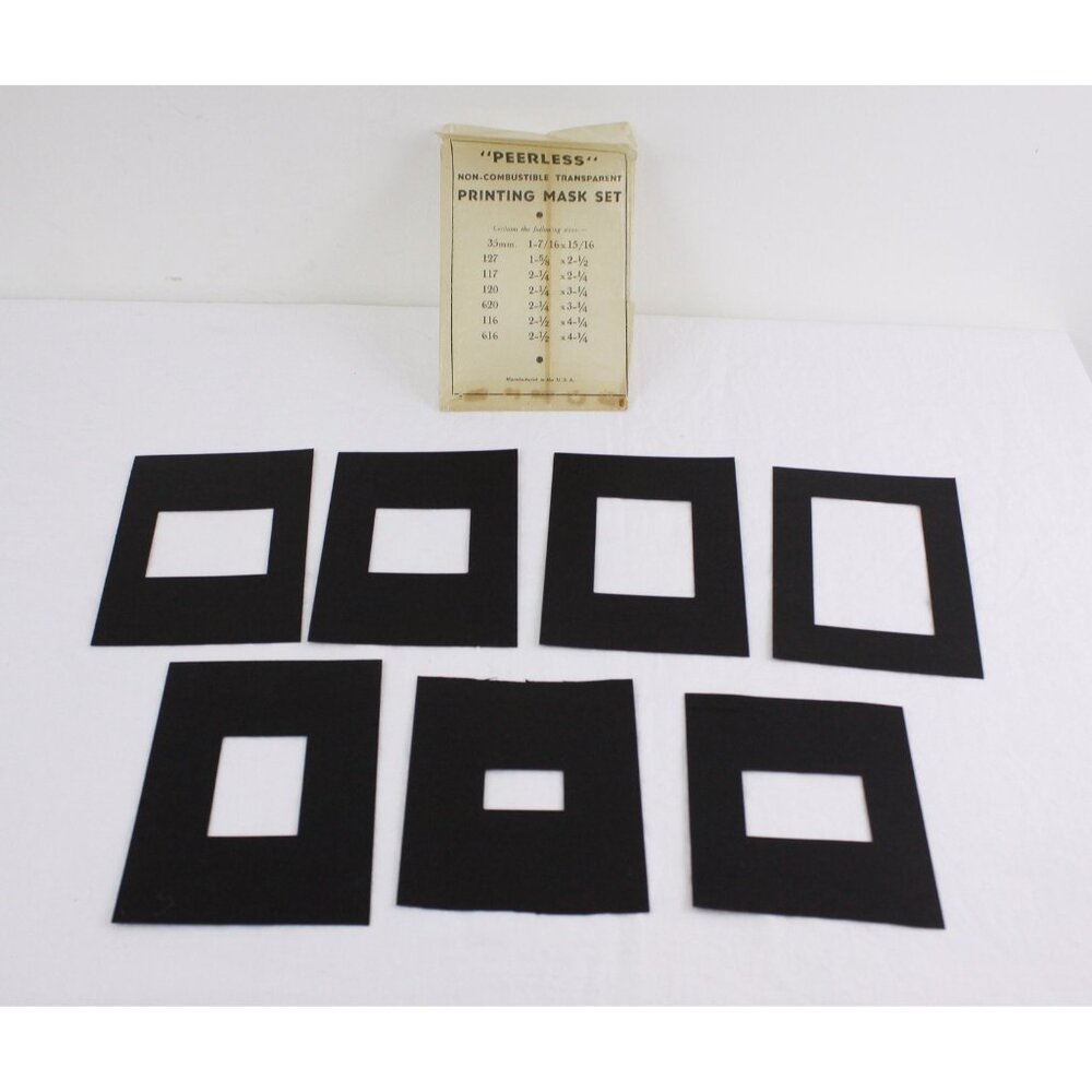 Vintage photographic darkroom printing mask set for 7 negative sizes by Peerless